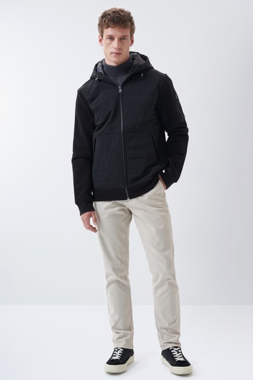 Jacket padded in front, with hood