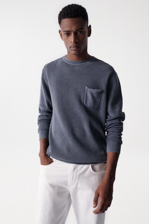 Knitted jumper with pocket and wash effects