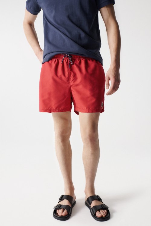 Red swimming shorts with drawstring