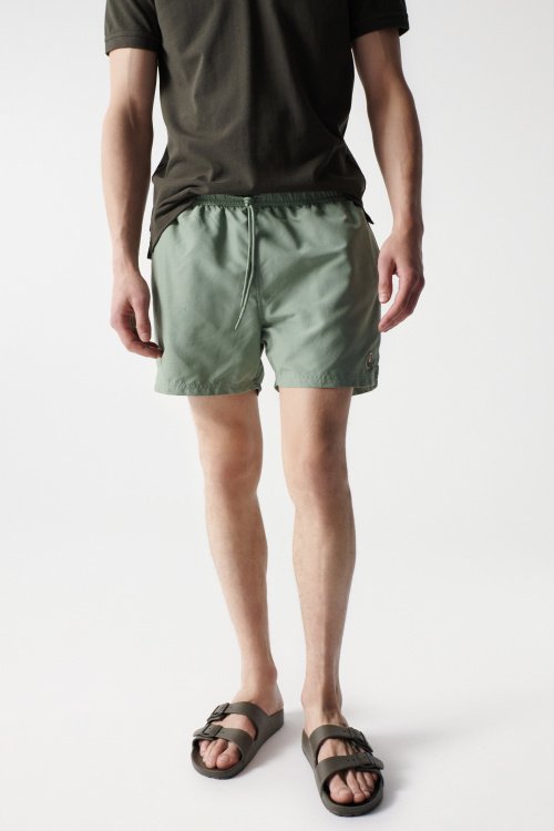 Green swimming shorts with drawstring