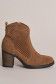 Perforated suede boot with a classic heel
